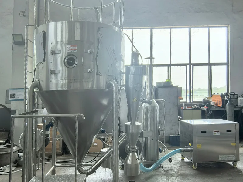 Laboratory spray drying installation with wet scrubbing and cooled pneumatic conveying